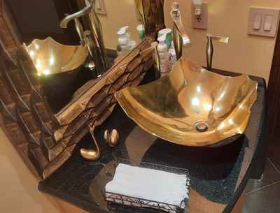 Freeform brass polished sink coated and protected